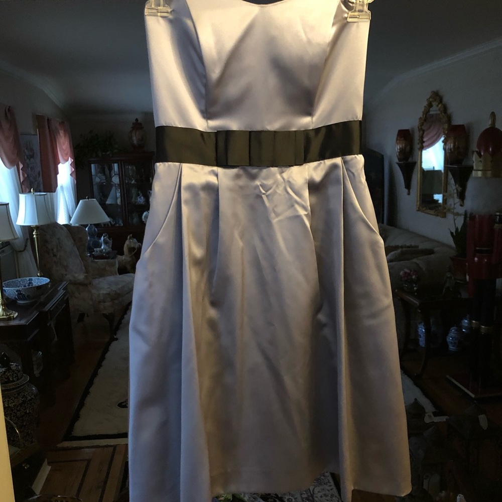 Tea length gray satin dress with black belt